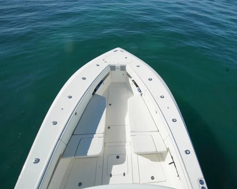 Slide: The Image of 2018 SeaVee 390Z boat bow on calm water, showcasing spacious deck design. - 7