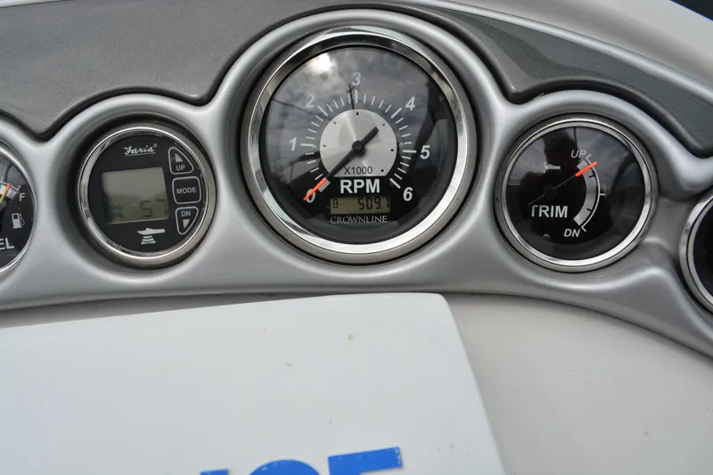 Slide: The Image of Dashboard of 2007 Crownline 275 CCR boat showing RPM and trim gauges. - 10