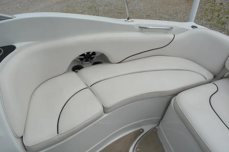 Slide: The Image of 2007 Crownline 275 CCR boat interior with white cushioned seating. - 12