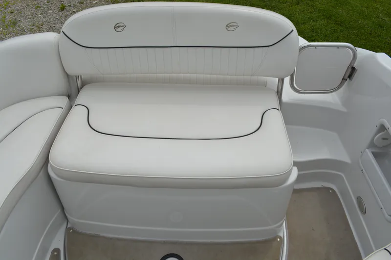 Slide: The Image of 2007 Crownline 275 CCR boat interior with white cushioned seating and sleek design. - 13