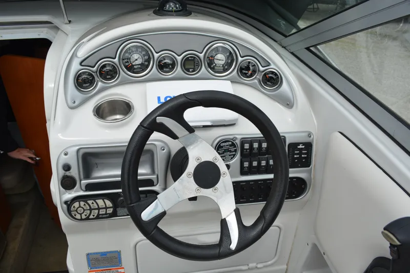 Slide: The Image of 2007 Crownline 275 CCR boat dashboard with steering wheel and instrument panel. - 17