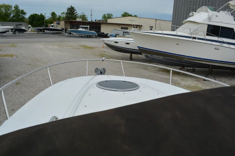 Slide: The Image of 2007 Crownline 275 CCR boat in a marina, surrounded by other vessels. - 7