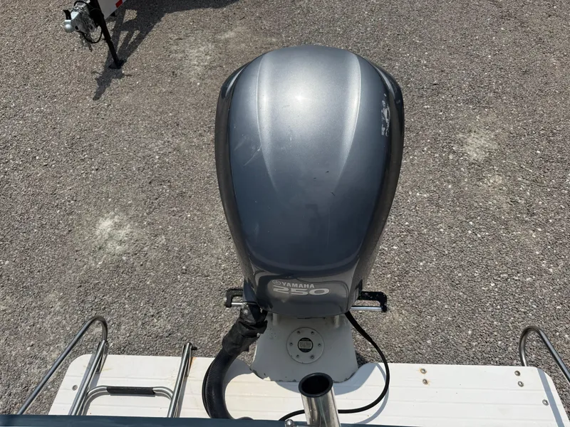 Slide: The Image of Outboard motor on a 1993 Grady-White Explorer 24 boat, viewed from above. - 13