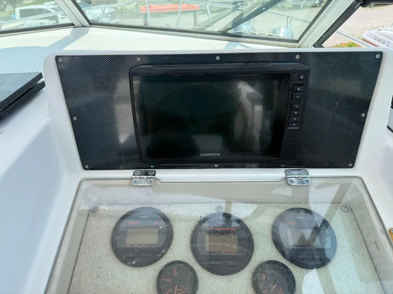 Slide: The Image of Dashboard of 1993 Grady-White Explorer 24 with Garmin display and gauges. - 20