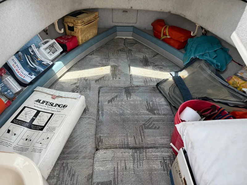 Slide: The Image of Interior of 1993 Grady-White Explorer 24 boat with various stored items. - 24