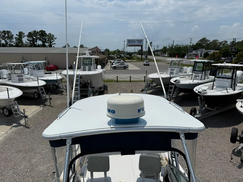 Slide: The Image of 1993 Grady-White Explorer 24 boat in a dealership lot with other boats. - 29