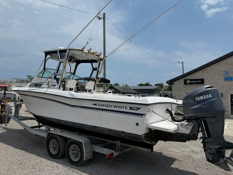 Slide: The Image of 1993 Grady-White Explorer 24 boat on trailer with Yamaha outboard motor. - 3