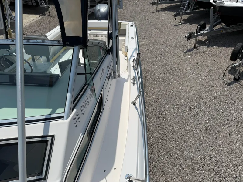 Slide: The Image of 1993 Grady-White Explorer 24 boat on gravel lot, side view. - 30