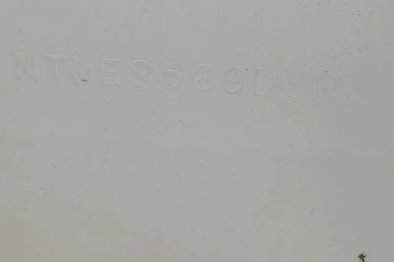 Slide: The Image of 1993 Grady-White Explorer 24 hull identification number on white surface. - 32