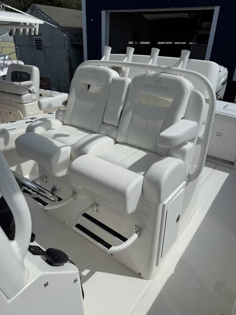 Slide: The Image of 2021 Regulator 31 boat with luxurious white seating and modern design. - 5