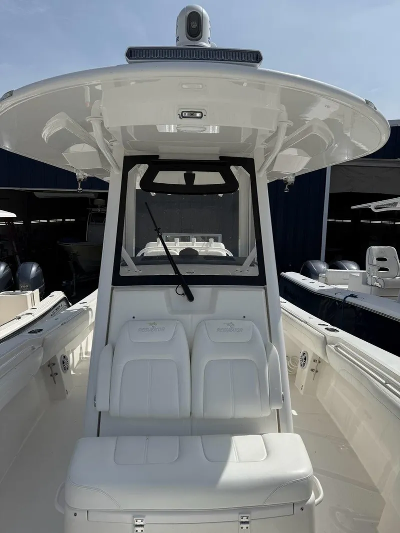 Slide: The Image of 2021 Regulator 31 boat with dual seating and modern helm station. - 9