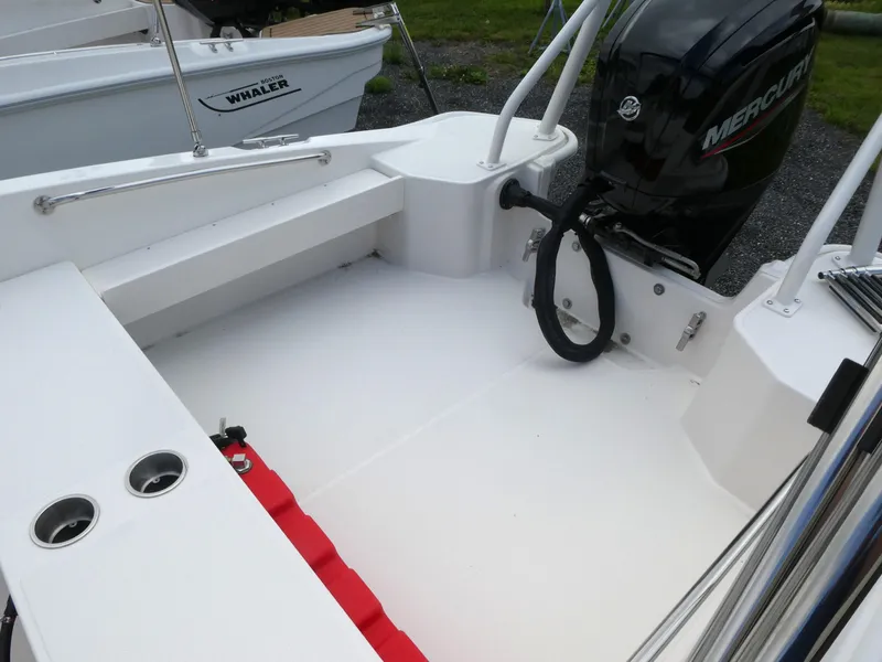 Slide: The Image of 2025 Boston Whaler 160 Super Sport boat interior with Mercury engine. - 6