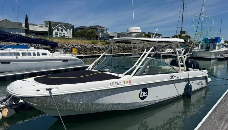 The Image of 2016 Boston Whaler 270 Dauntless boat docked in a marina. - 1