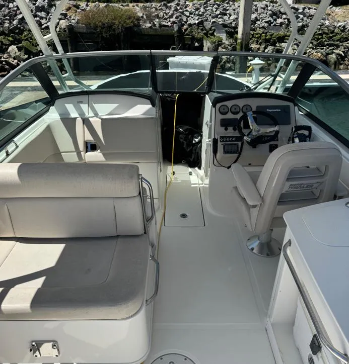 Slide: The Image of 2016 Boston Whaler 270 Dauntless boat interior with seating and control panel. - 3