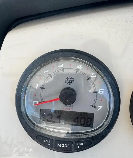 Slide: The Image of Close-up of a 2016 Boston Whaler 270 Dauntless tachometer displaying RPM and engine hours. - 6