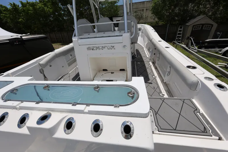 Slide: The Image of 2020 Sea Fox 328 Commander boat interior with seating and storage compartments. - 11