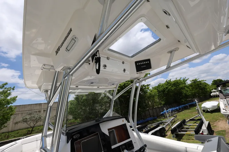 Slide: The Image of 2020 Sea Fox 328 Commander boat interior with electronics and canopy. - 15