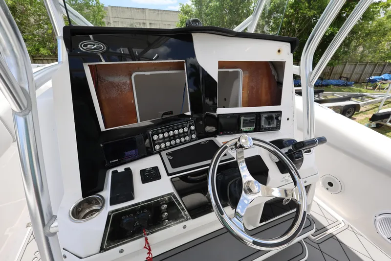Slide: The Image of 2020 Sea Fox 328 Commander boat dashboard with steering wheel and control panel. - 16