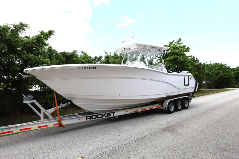 Slide: The Image of 2020 Sea Fox 328 Commander boat on trailer, parked on roadside. - 2