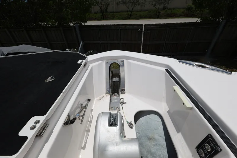 Slide: The Image of 2020 Sea Fox 328 Commander boat interior, featuring anchor storage and deck details. - 22