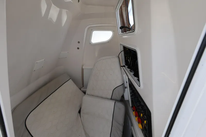 Slide: The Image of Interior cabin of 2020 Sea Fox 328 Commander boat, featuring seating and control panels. - 25