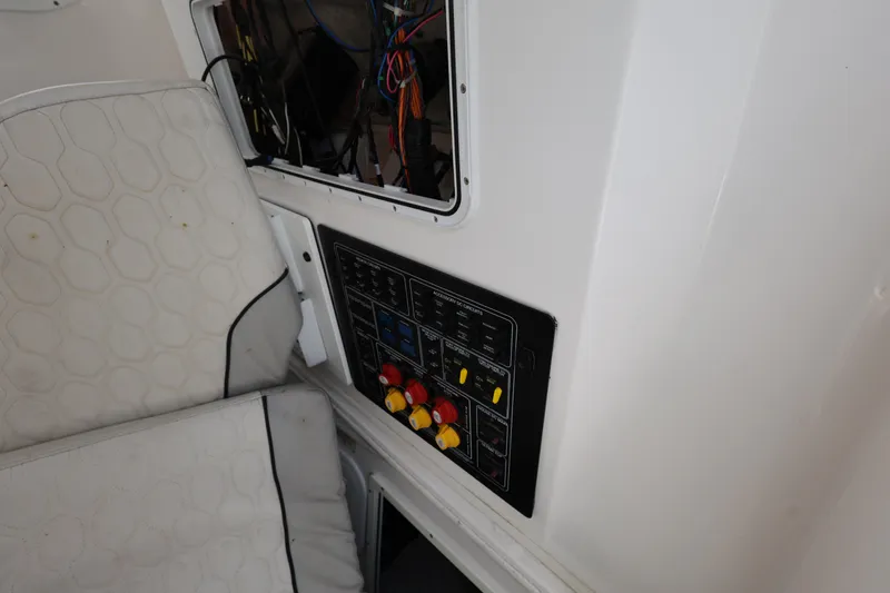 Slide: The Image of 2020 Sea Fox 328 Commander control panel with wiring and cushioned seating. - 26