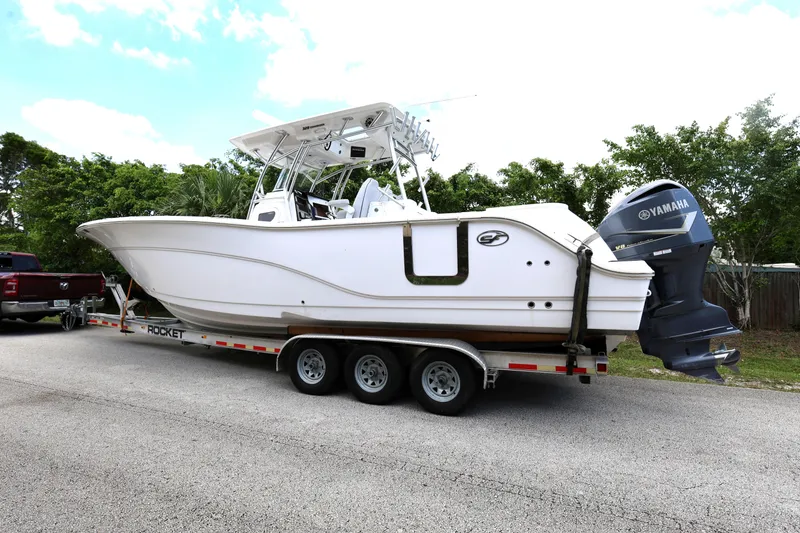 Slide: The Image of 2020 Sea Fox 328 Commander boat on trailer with Yamaha engine, parked on roadside. - 4