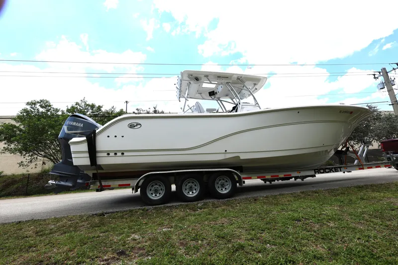 Slide: The Image of 2020 Sea Fox 328 Commander boat on trailer, side view, outdoors. - 7
