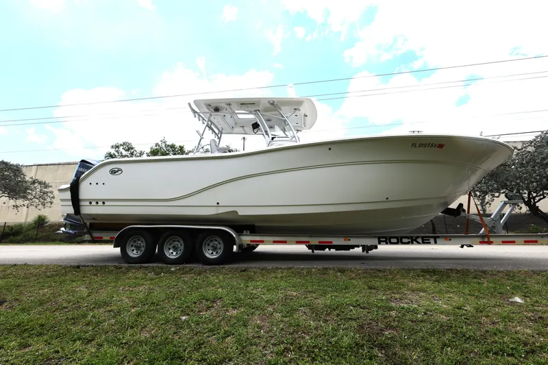 Slide: The Image of 2020 Sea Fox 328 Commander boat on trailer, side view, outdoors. - 8