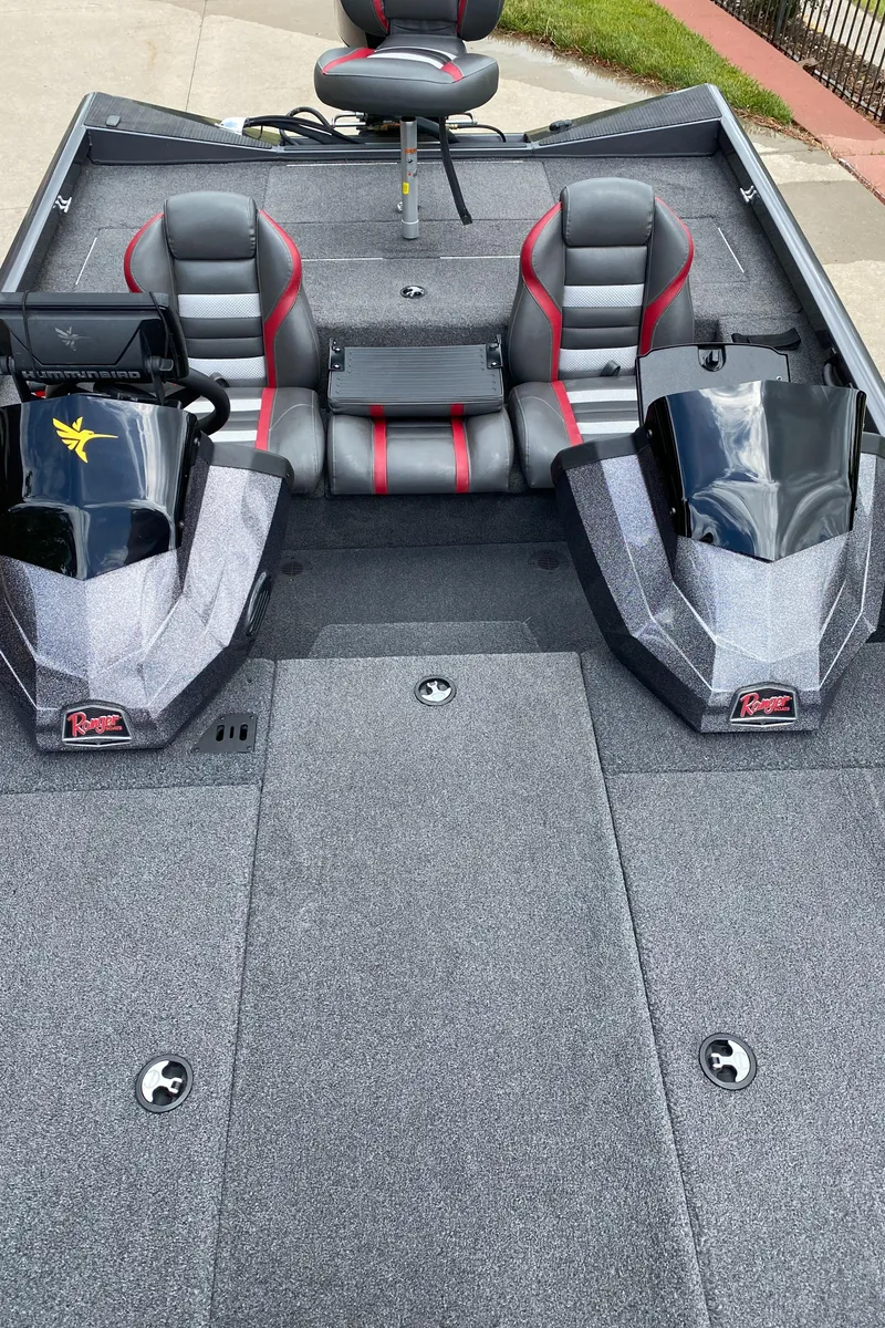 Slide: The Image of 2019 Ranger RT188 boat interior with dual consoles and gray seating. - 11