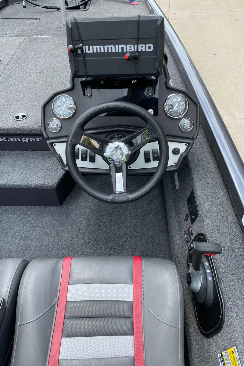 Slide: The Image of 2019 Ranger RT188 boat dashboard with Humminbird electronics and steering wheel. - 13