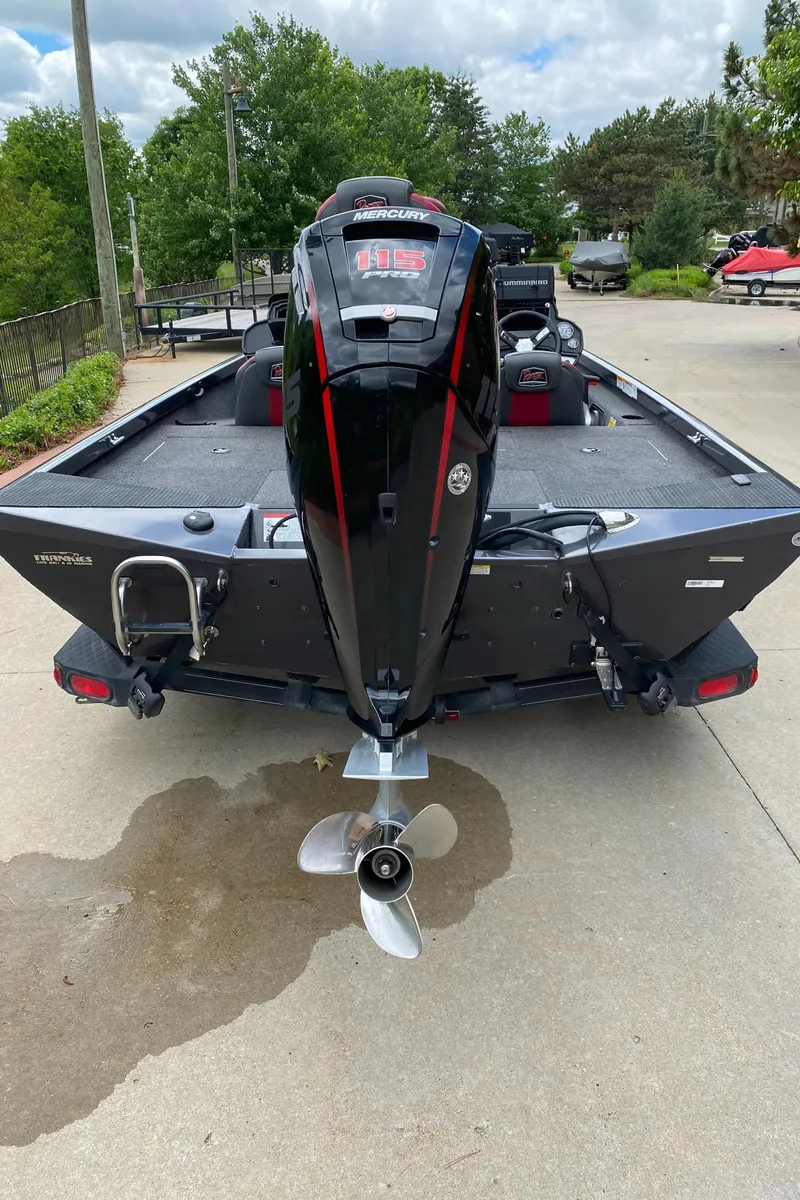 Slide: The Image of 2019 Ranger RT188 boat with powerful outboard motor, parked on concrete driveway. - 8