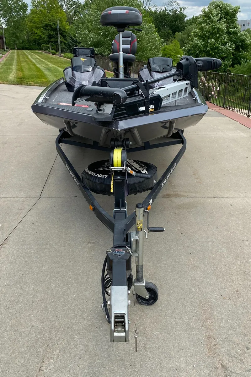 Slide: The Image of 2019 Ranger RT188 boat on trailer, parked on concrete driveway. - 9