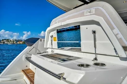 Slide: The Image of 2023 Beneteau Gran Turismo 45 yacht with outdoor kitchen and ocean view. - 12