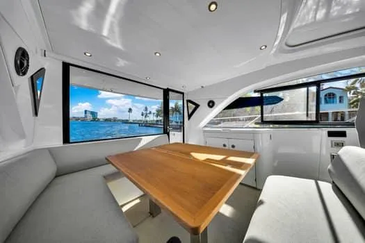 Slide: The Image of Interior of 2023 Beneteau Gran Turismo 45 yacht with elegant seating and ocean view. - 15