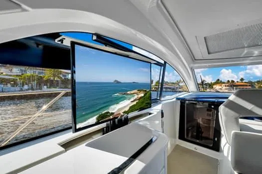 Slide: The Image of Interior of 2023 Beneteau Gran Turismo 45 yacht with ocean view through large windows. - 16