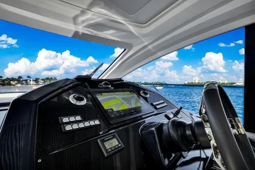 Slide: The Image of Cockpit view of 2023 Beneteau Gran Turismo 45 yacht with ocean backdrop. - 21