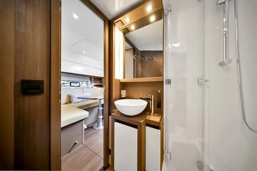 Slide: The Image of Luxurious bathroom interior of 2023 Beneteau Gran Turismo 45 yacht, featuring modern fixtures. - 24