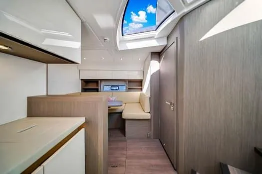 Slide: The Image of 2023 Beneteau Gran Turismo 45 interior with modern design and skylight. - 29