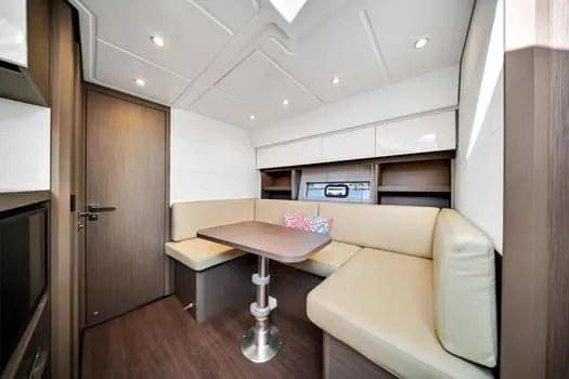 Slide: The Image of 2023 Beneteau Gran Turismo 45 interior with modern seating and table. - 31