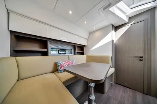 Slide: The Image of Interior of 2023 Beneteau Gran Turismo 45 yacht with modern seating and table. - 32