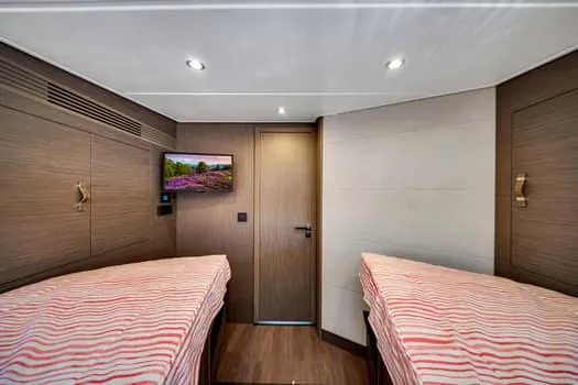 Slide: The Image of Interior cabin of 2023 Beneteau Gran Turismo 45 with twin beds and modern decor. - 35