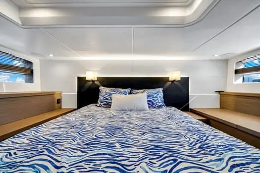 Slide: The Image of Luxurious bedroom interior of 2023 Beneteau Gran Turismo 45 yacht with zebra-patterned bedding. - 39