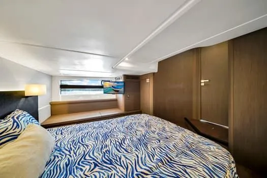 Slide: The Image of Luxurious cabin interior of 2023 Beneteau Gran Turismo 45 yacht with stylish bedding. - 40
