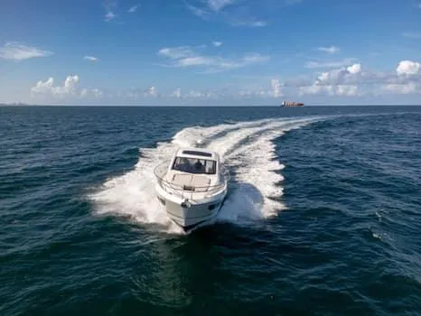 Slide: The Image of 2023 Beneteau Gran Turismo 45 cruising on open sea under clear blue sky. - 8