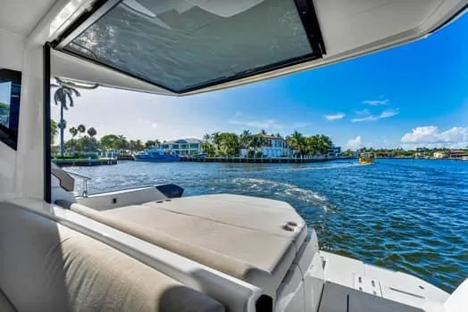 Slide: The Image of 2023 Beneteau Gran Turismo 45 yacht interior with scenic waterfront view. - 9