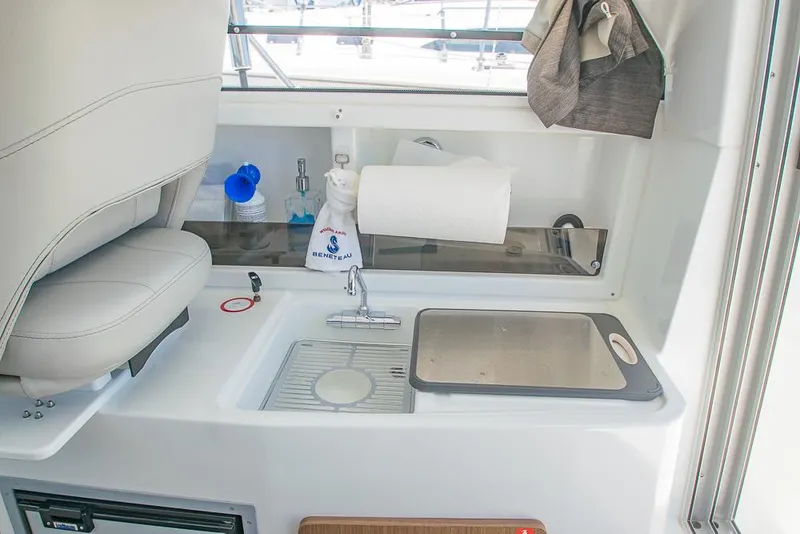Slide: The Image of Interior of 2021 Beneteau Antares 8 boat with sink and storage area. - 10