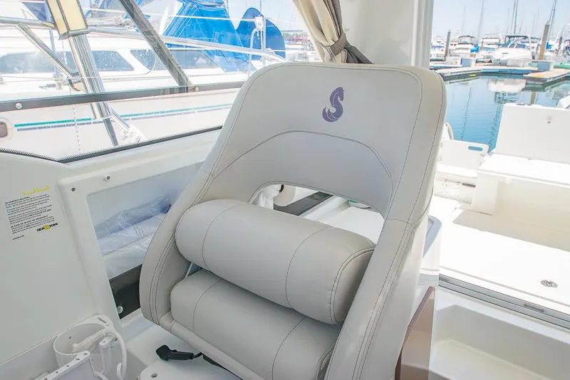 Slide: The Image of Captain's seat on 2021 Beneteau Antares 8, docked at marina. - 15