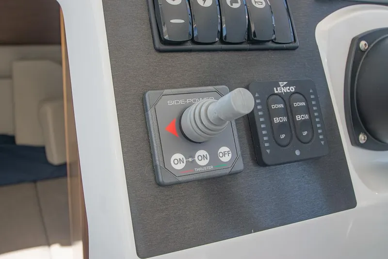 Slide: The Image of Control panel of a 2021 Beneteau Antares 8 boat with joystick and switches. - 17