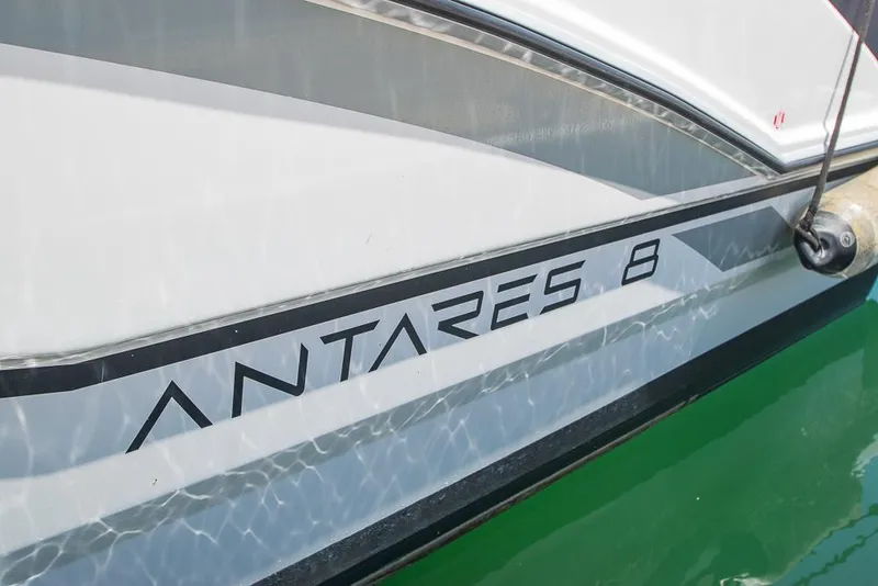 Slide: The Image of 2021 Beneteau Antares 8 boat side view with model name on hull. - 3